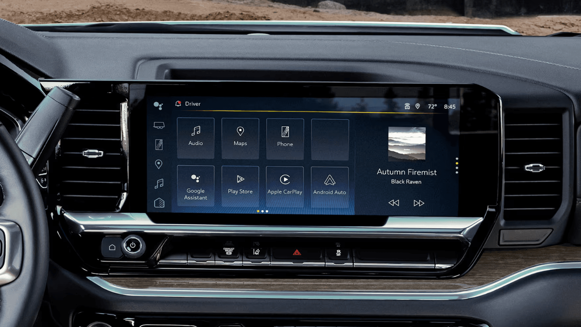 Close up of dashboard touchscreen displaying apps like audio, maps, phone, Apple CarPlay, and Android Auto