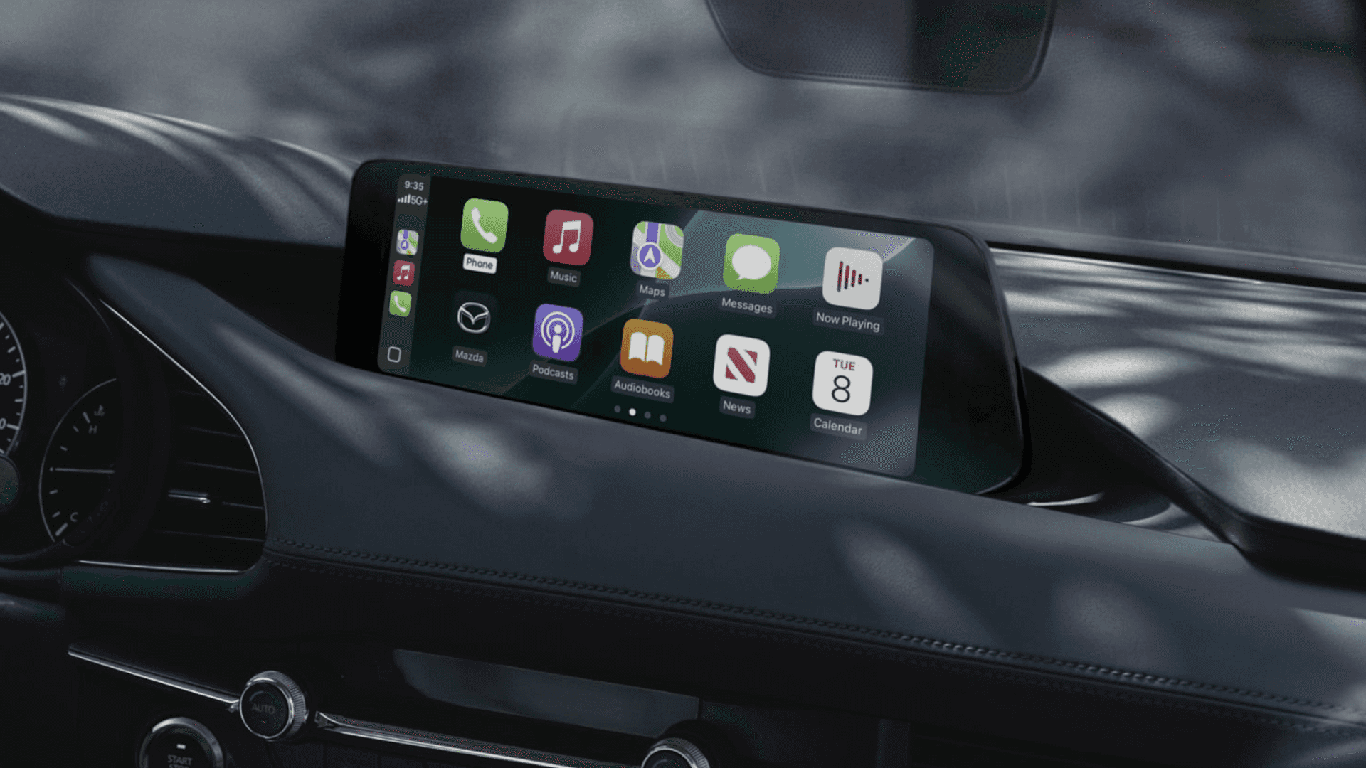 Wide center display inside Mazda3 showing Apple CarPlay interface with apps like Maps, Music, Messages, and Calendar