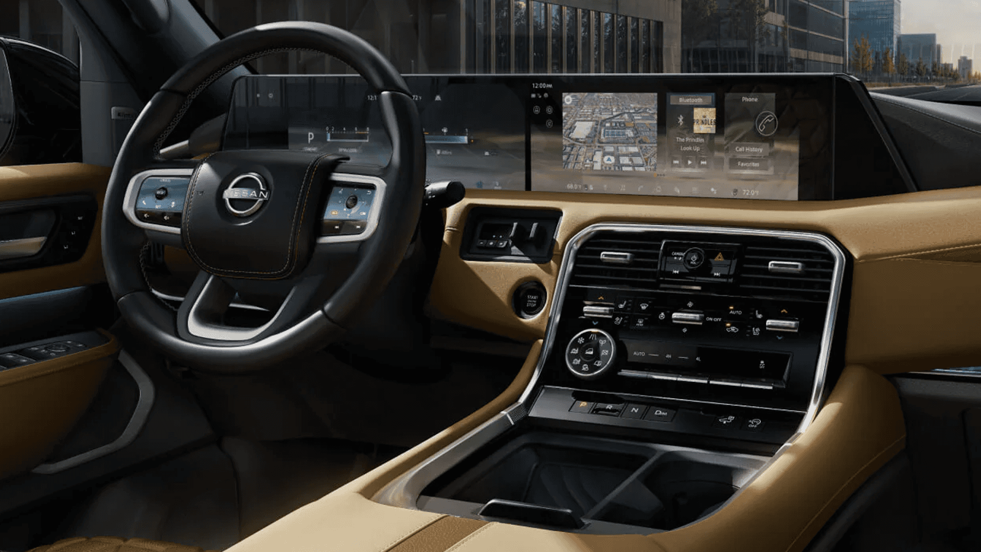 Dashboard view with steering wheel, dual digital displays, center controls, and brown interior trim in daylight