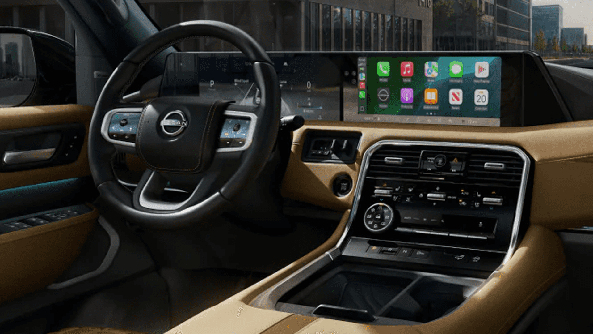 Interior view showing steering wheel, digital gauge cluster, and wide infotainment display with app icons across dashboard