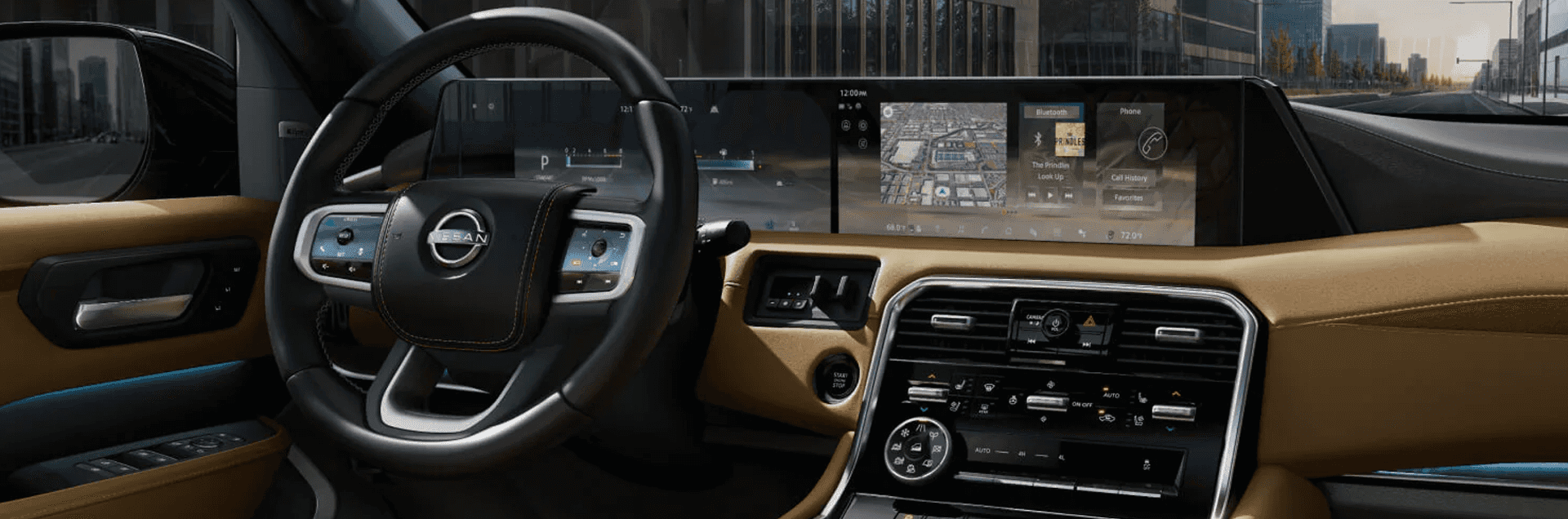 Wide interior view showing steering wheel, center console controls, and dual digital displays across dashboard