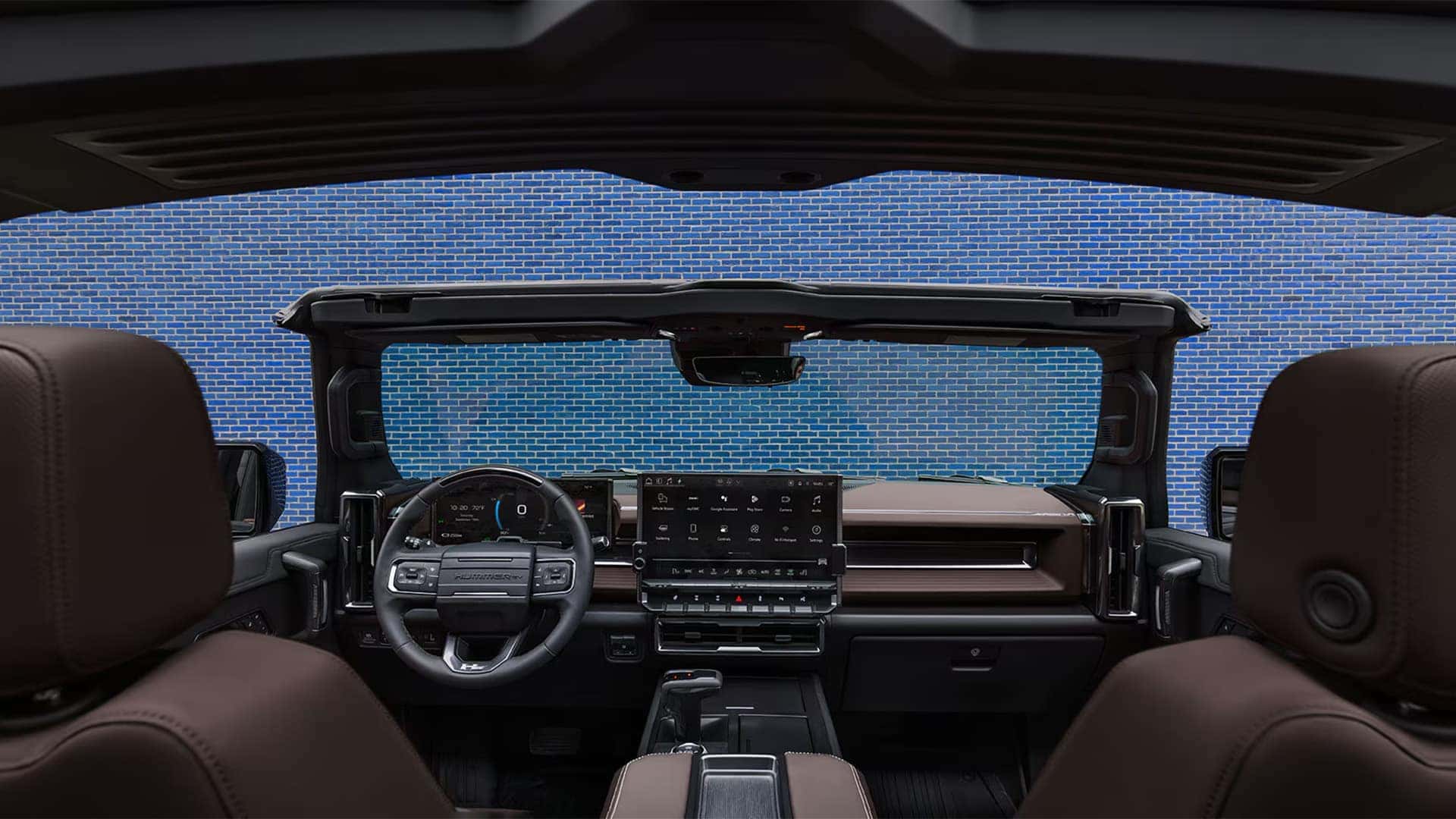 2026 GMC HUMMER EV SUV interior with Infinity Roof panels removed, showing open-air cabin and dashboard layout