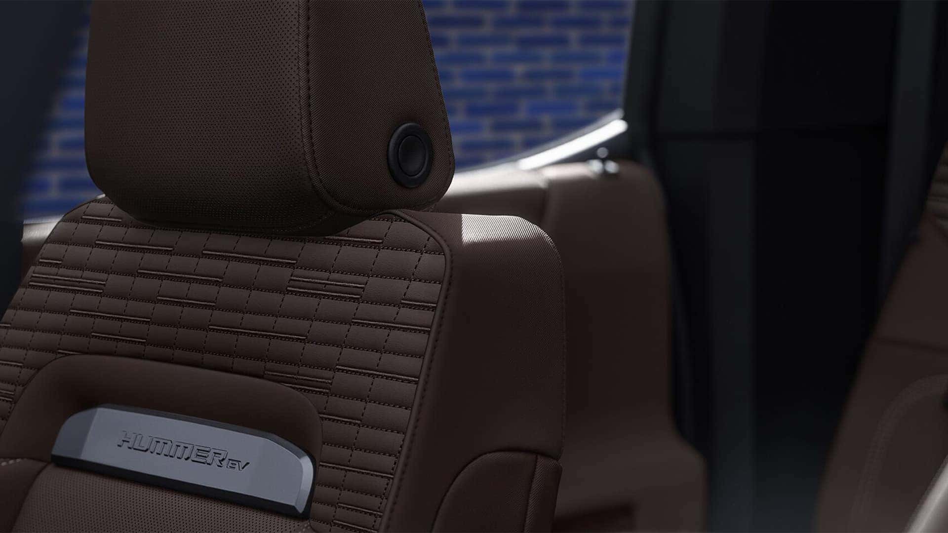 2026 GMC HUMMER EV SUV premium seat with HUMMER EV badge and detailed stitching on leather upholstery