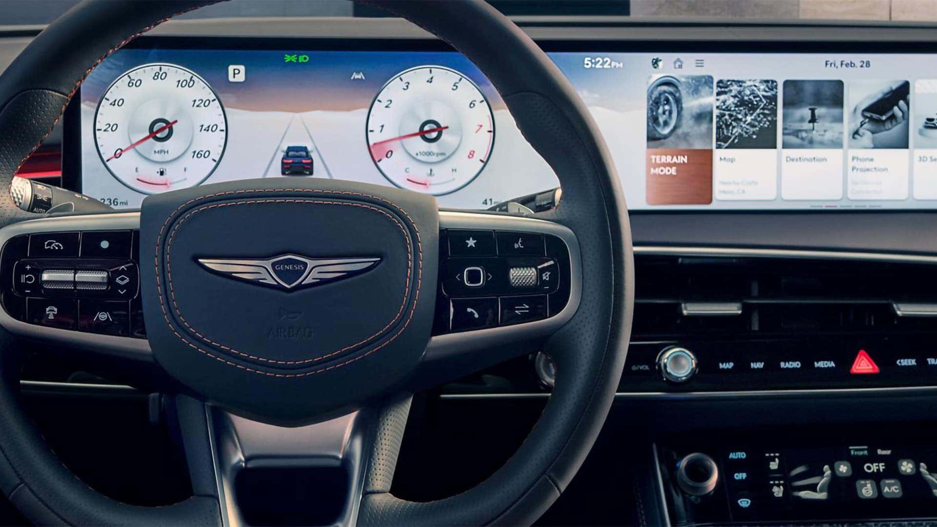 2026 Genesis GV70 dashboard with digital instrument cluster and wide infotainment display behind the steering wheel