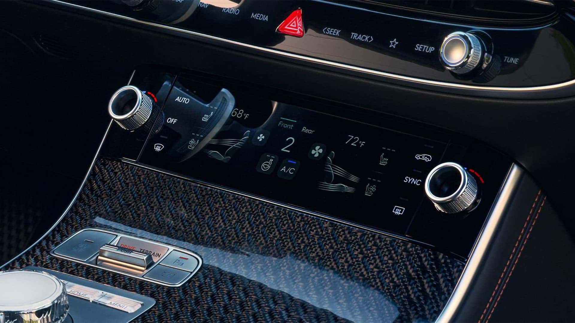 2026 Genesis GV70 climate control panel with dual-zone settings, touch display, and premium trim detailing