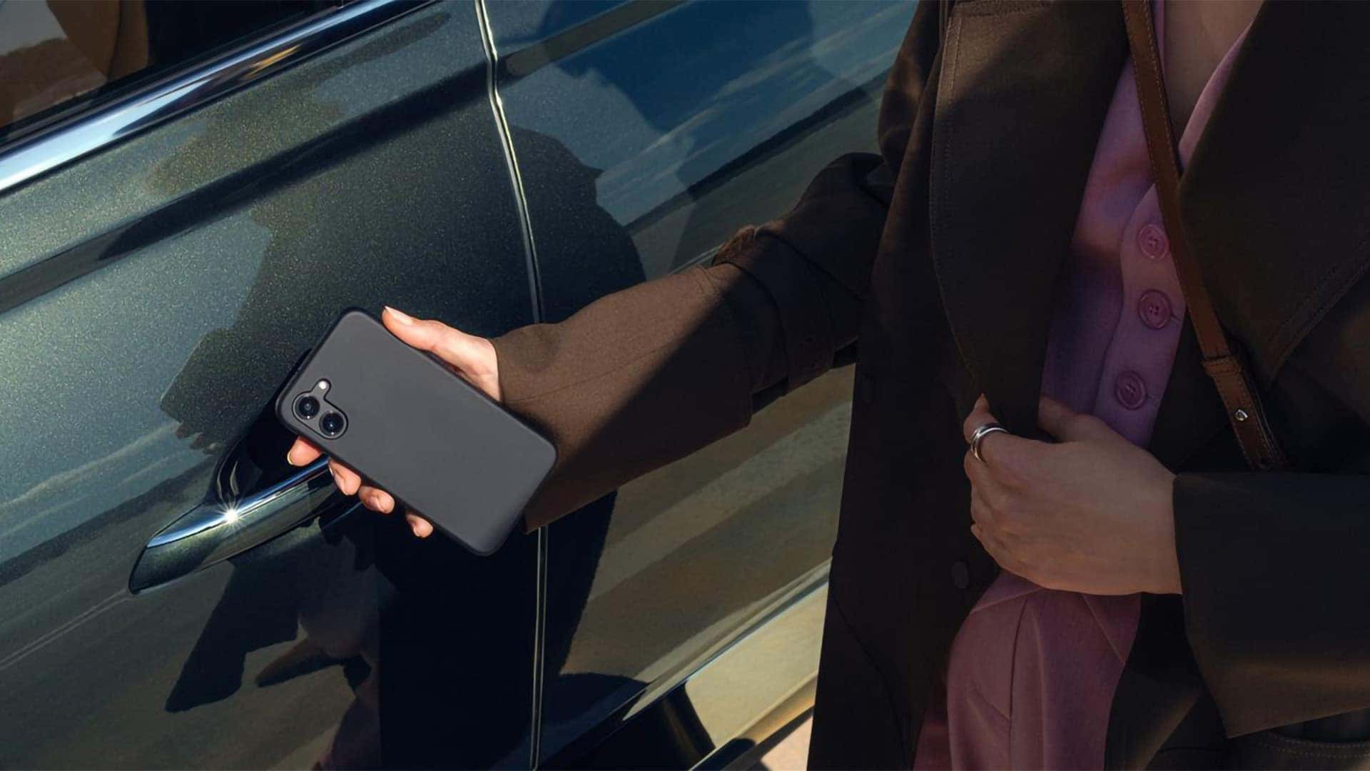 Genesis Digital Key access on the 2026 Genesis GV80 using a smartphone near the door handle