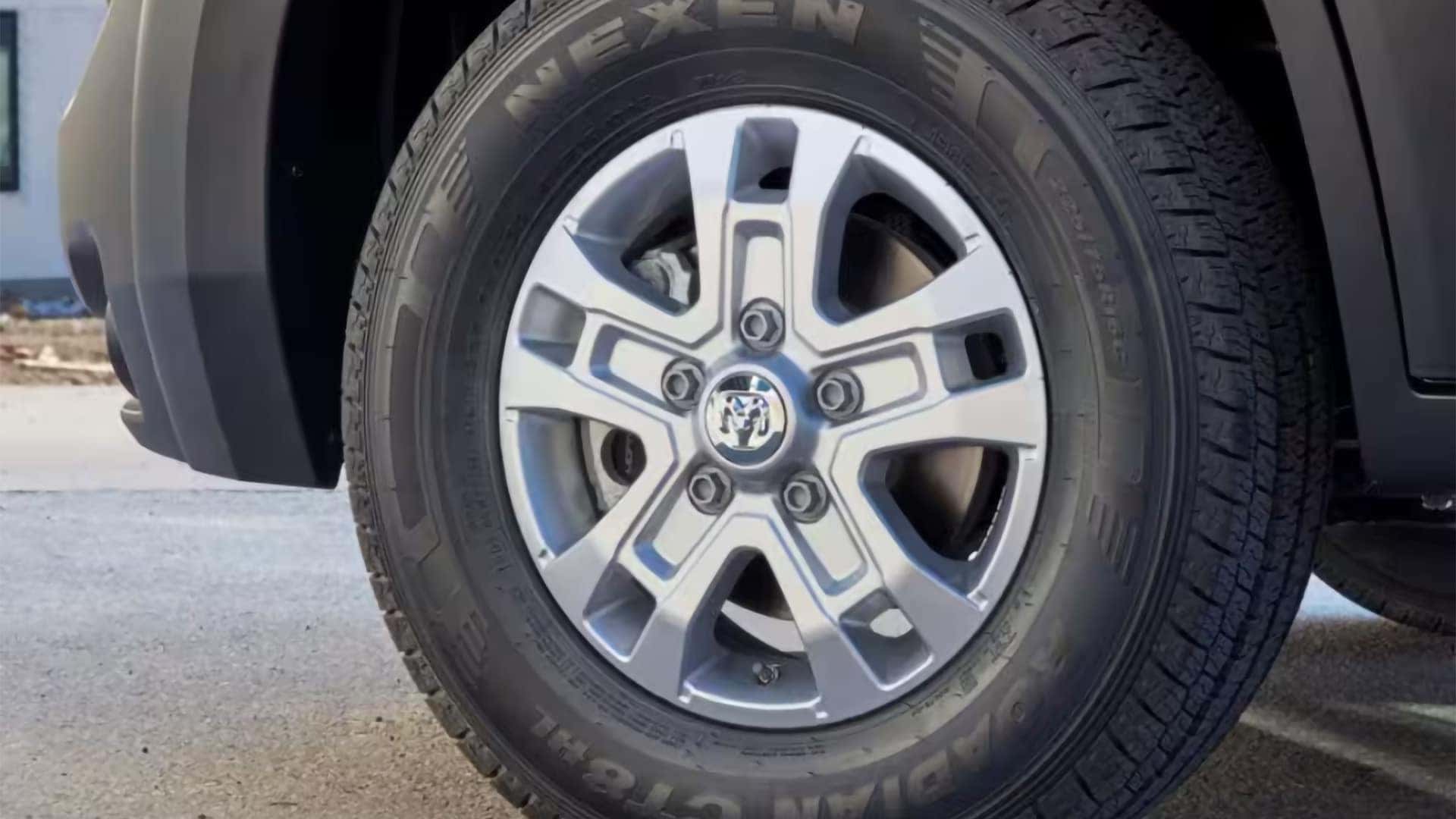 Close up of RAM ProMaster Cargo Van wheel and tire showing durable steel wheel design