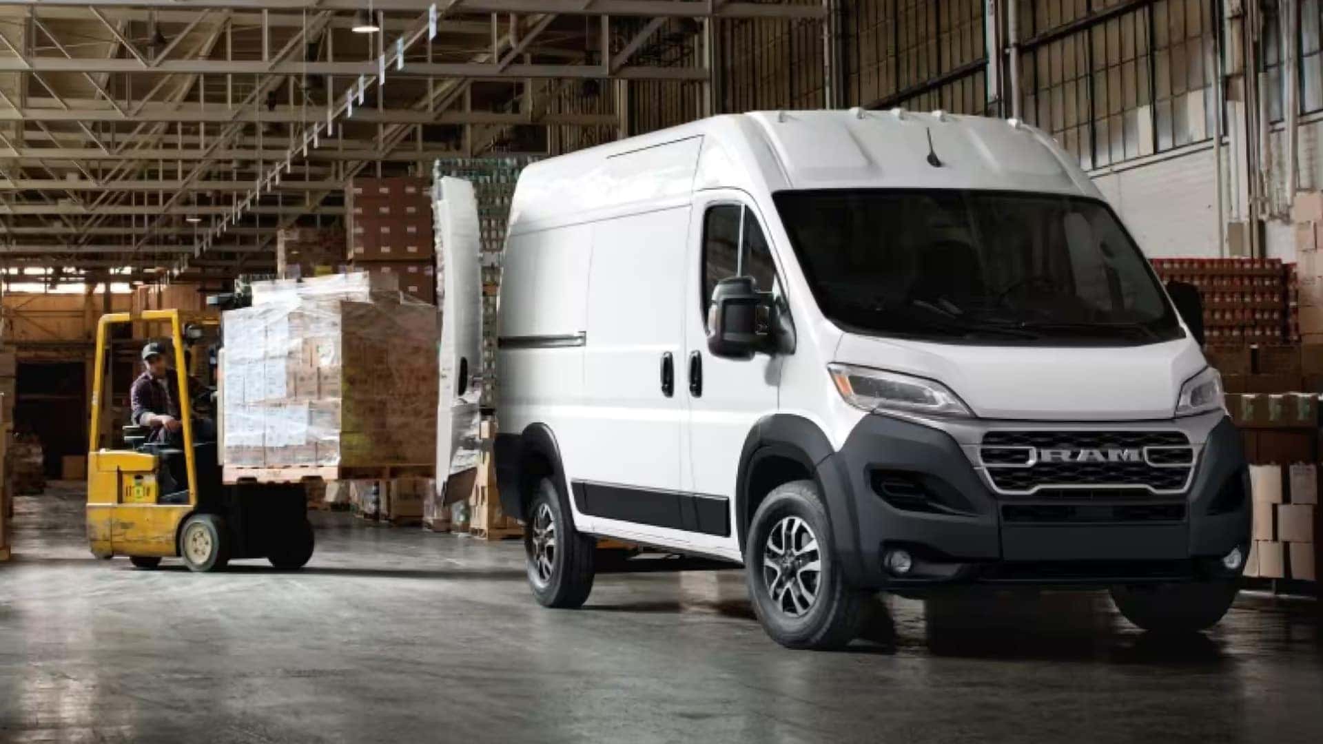 2026 RAM ProMaster Cargo Van inside a warehouse near a forklift showing cargo hauling capability