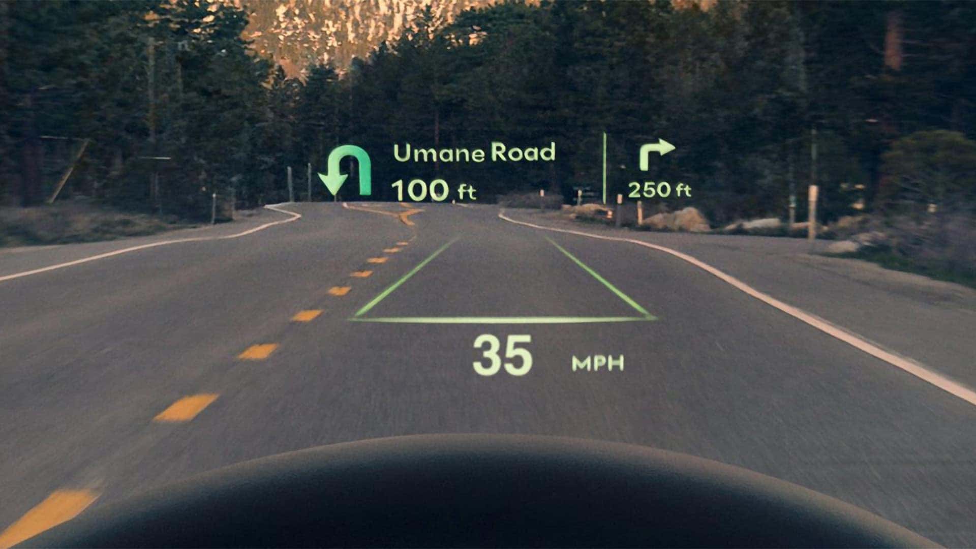 2026 Genesis GV70 head-up display projecting speed, lane guidance, and navigation directions onto the windshield