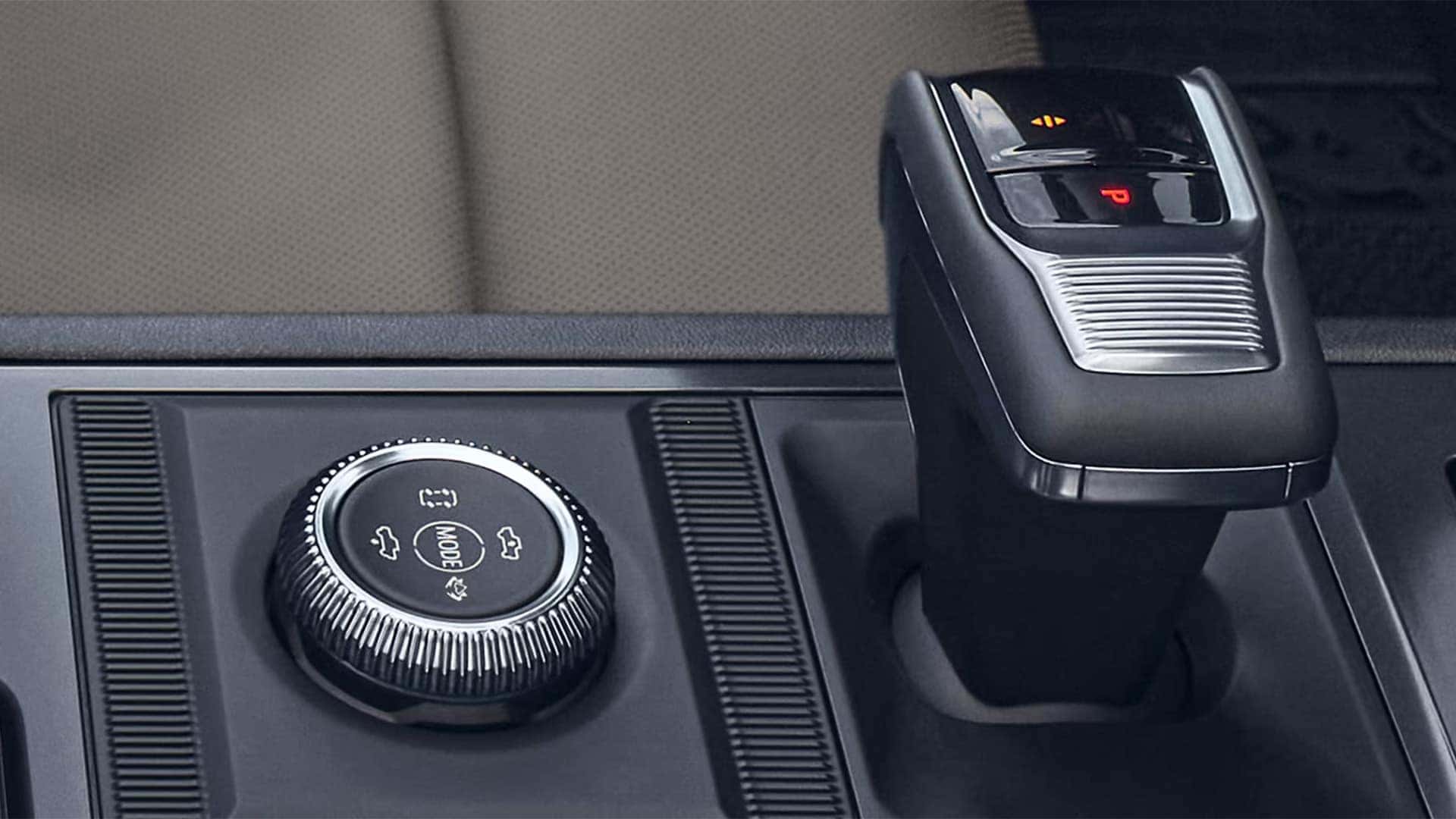 Close-up of 2026 GMC HUMMER EV SUV drive mode selector and electronic gear shifter on center console