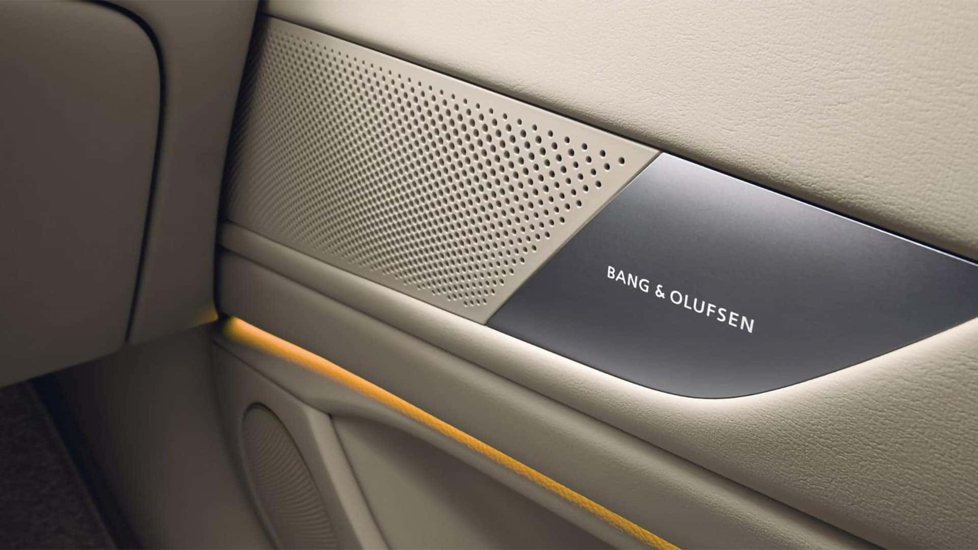 Bang and Olufsen speaker grille inside the 2026 Genesis G80 premium audio system with ambient lighting