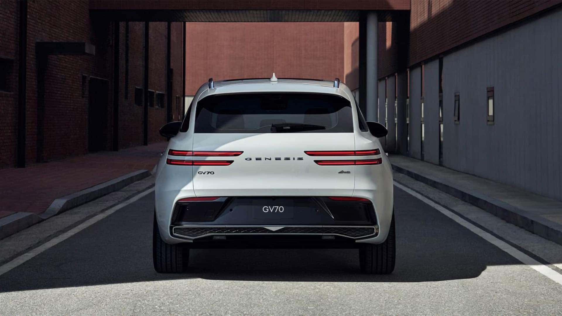 Rear view of 2026 Genesis GV70 with signature Two-Line LED taillights and sculpted liftgate design
