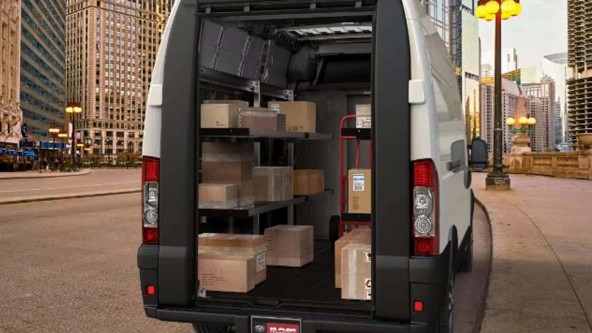 Rear cargo area of a 2026 RAM ProMaster Cargo Van loaded with boxes and delivery equipment