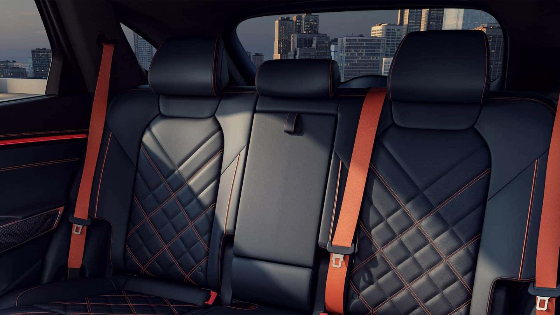 2026 Genesis GV70 interior with quilted leather seats, panoramic sunroof, and contrast stitching details