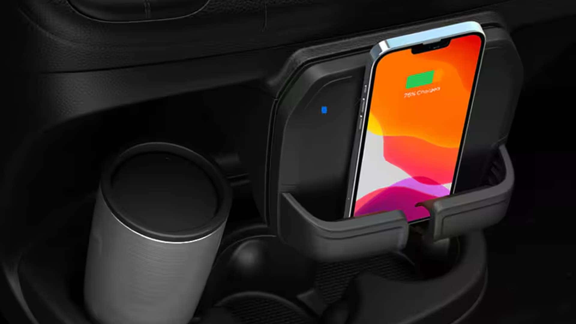 Wireless phone charging dock and cup holder inside 2026 RAM ProMaster Cargo Van center console