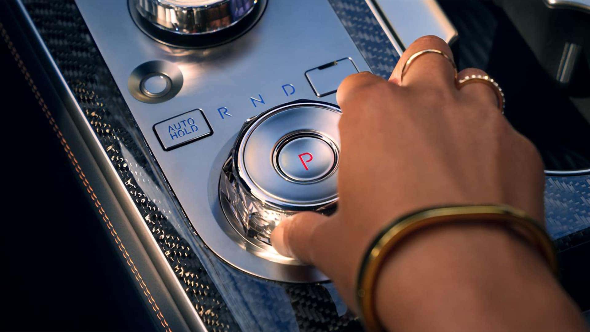 2026 Genesis GV70 rotary gear selector and center console with metallic finish and drive mode controls