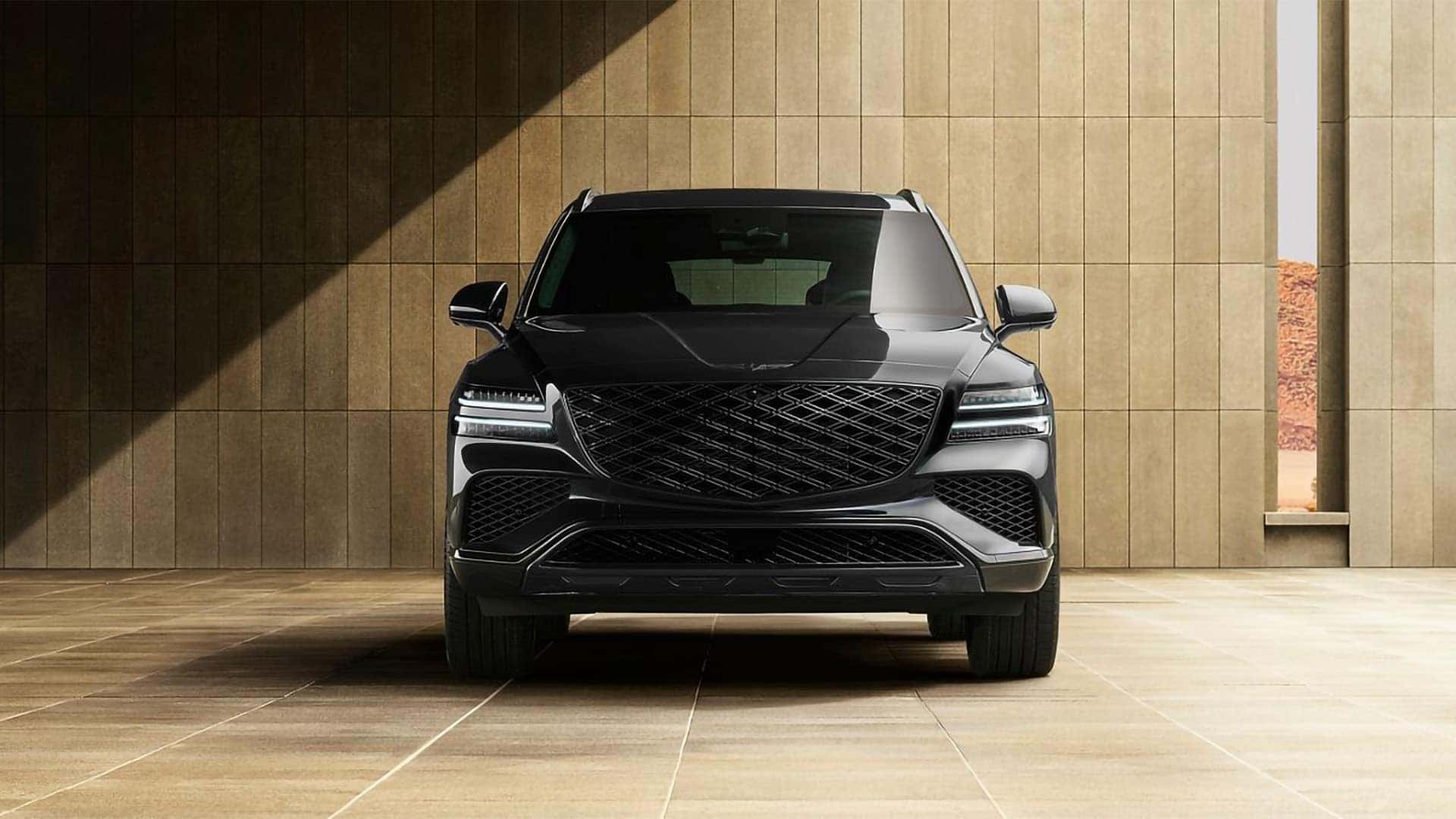 Front view of 2026 Genesis GV80 showcasing Crest Grille, LED lighting, and bold luxury SUV styling