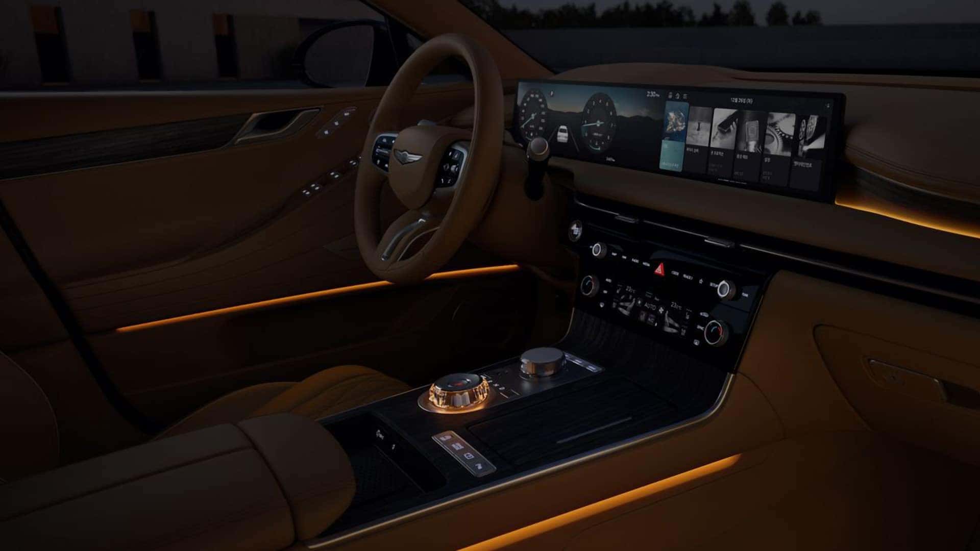 2026 Genesis G80 interior at night with ambient lighting, widescreen display, and luxury center console controls