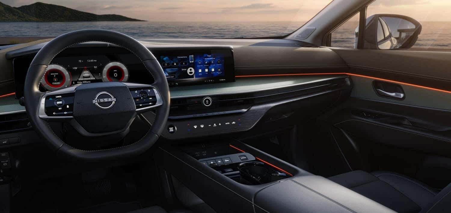 2026 Nissan Murano interior cockpit with digital instrument display, touchscreen, and ambient lighting across the dash
