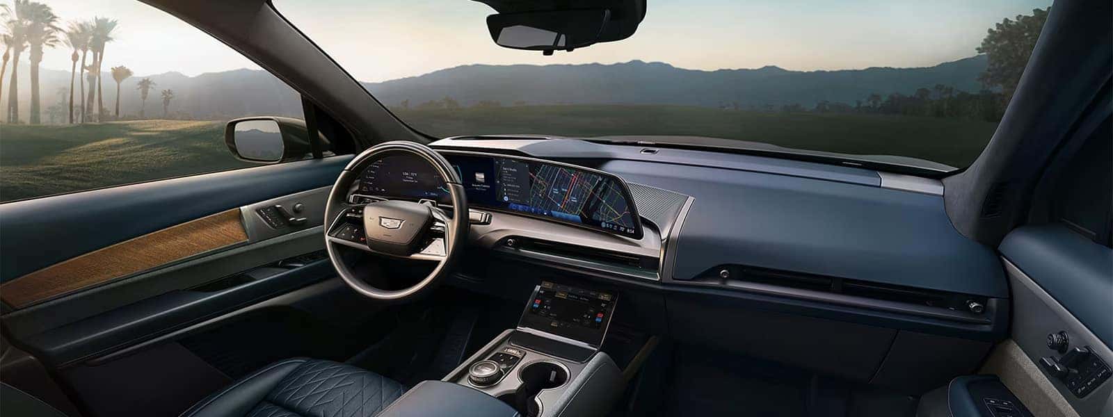 2026 Cadillac VISTIQ interior with curved digital display, steering wheel, and luxury electric SUV dashboard