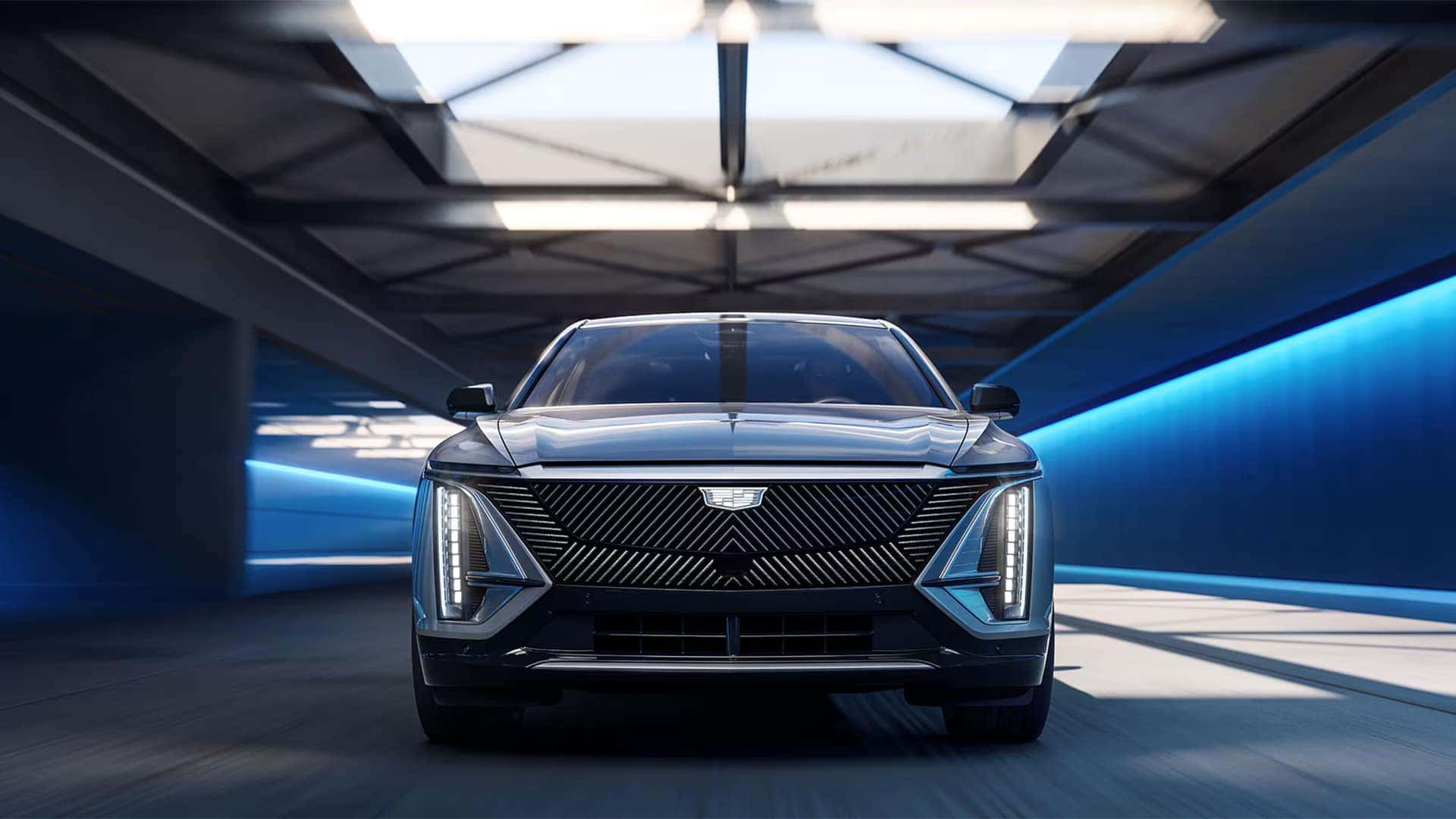 2026 Cadillac LYRIQ front exterior view showing vertical LED headlights, illuminated grille design, and modern electric SUV styling