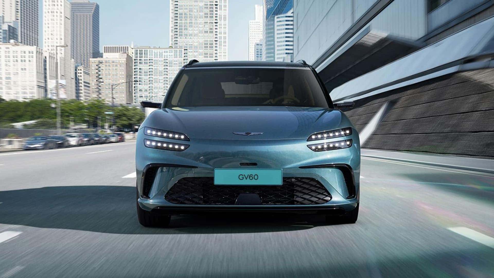 Front view of 2026 Genesis GV60 showing the three dimensional grille, lower fascia, and signature Two-Line LED headlights