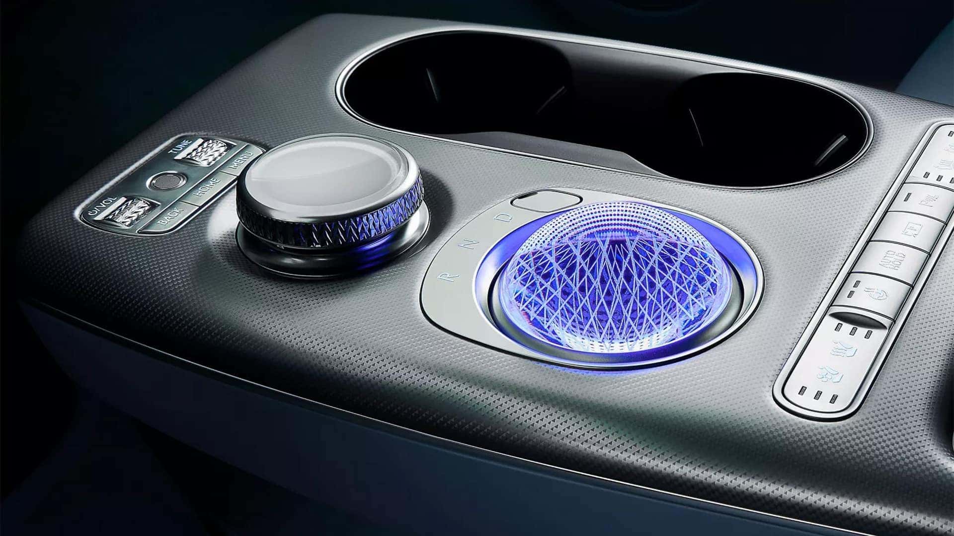 2026 Genesis GV60 Crystal Sphere center console with illuminated shift selector, cupholders, and infotainment controls