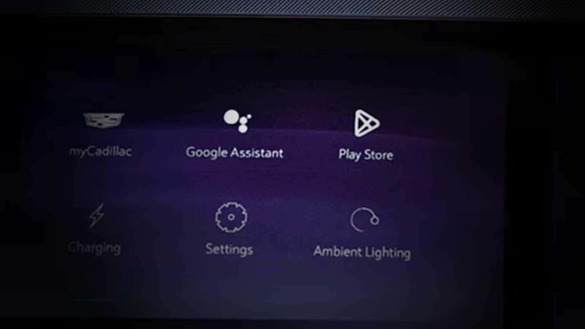 Close up of Cadillac display showing myCadillac, Google Assistant, Play Store, and settings icons