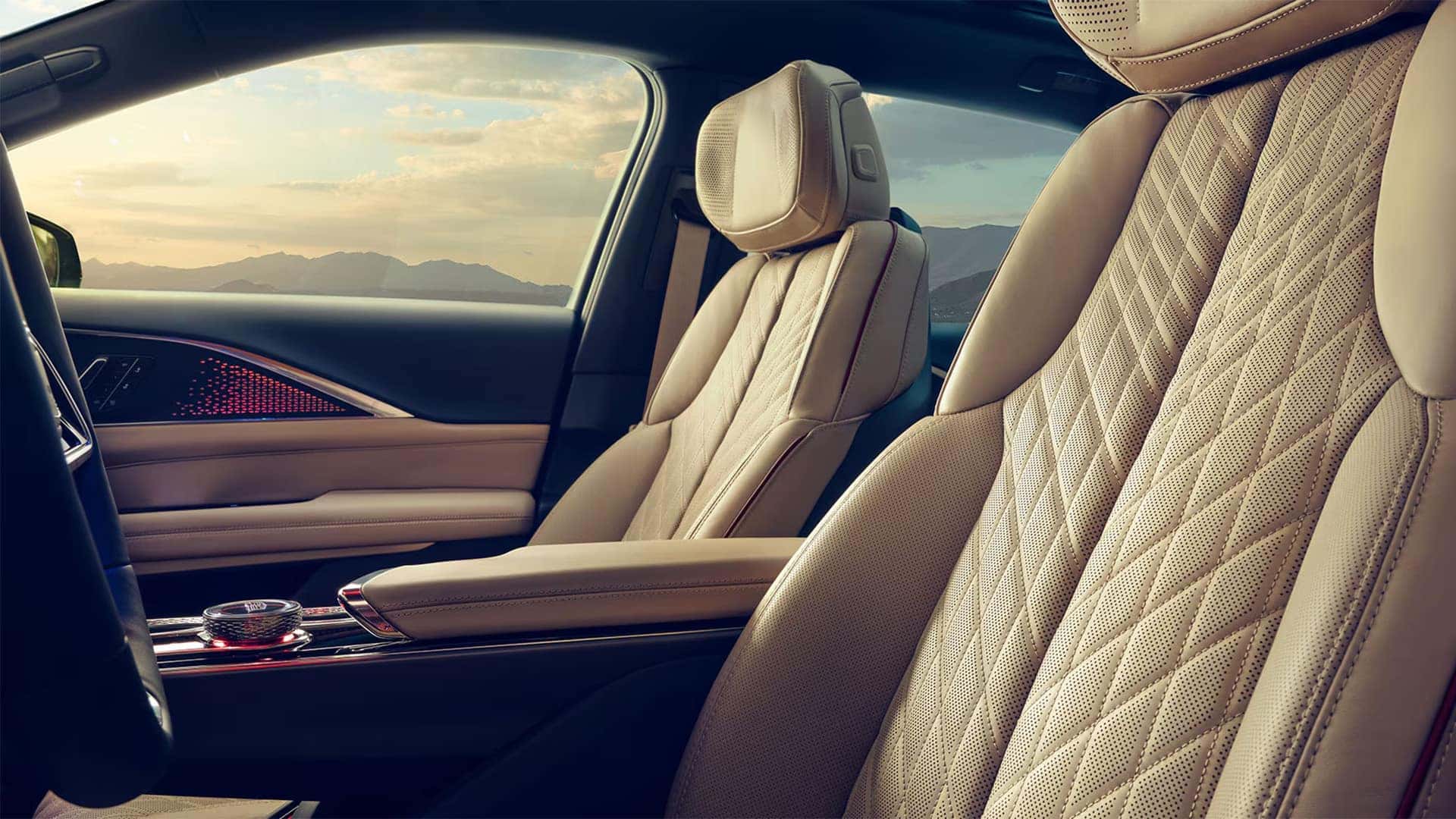 2026 Cadillac LYRIQ interior showing quilted front seats, premium upholstery, center console, and luxury cabin details