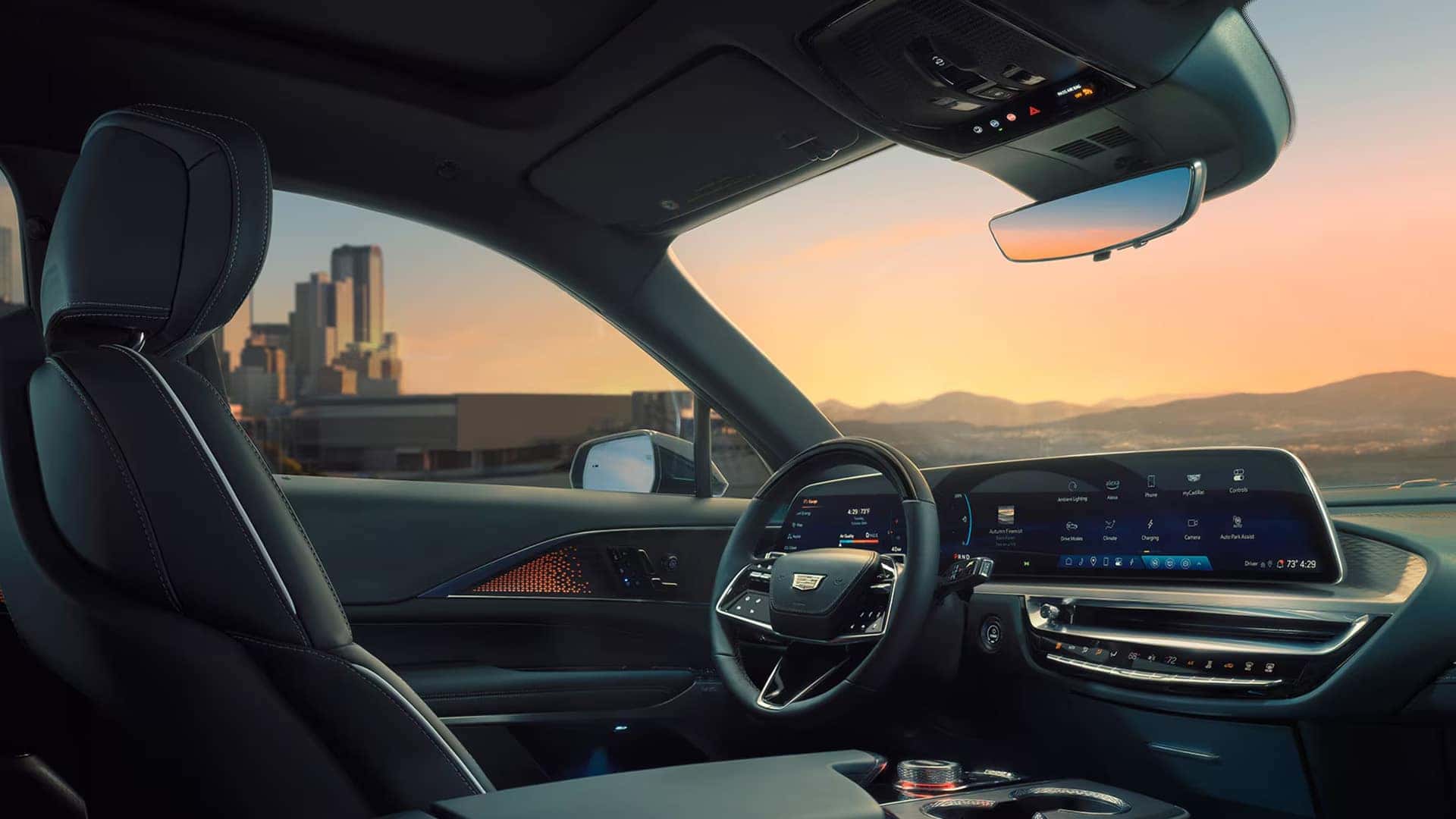 2026 Cadillac LYRIQ driver cockpit with 33-inch Horizon Display, steering wheel controls, and ambient lighting