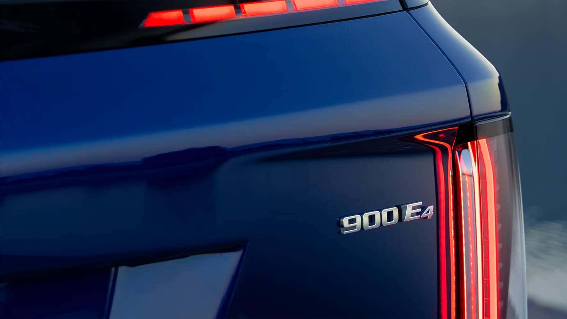 Close up of the 2026 Cadillac VISTIQ rear LED taillight and 900E4 badge on the blue liftgate