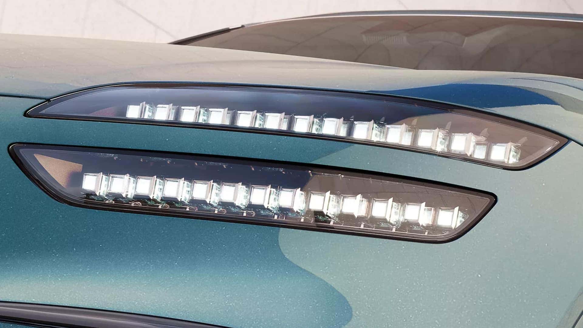 Close up of 2026 Genesis GV60 Two-Line LED headlamps with micro lens lighting detail on the front exterior