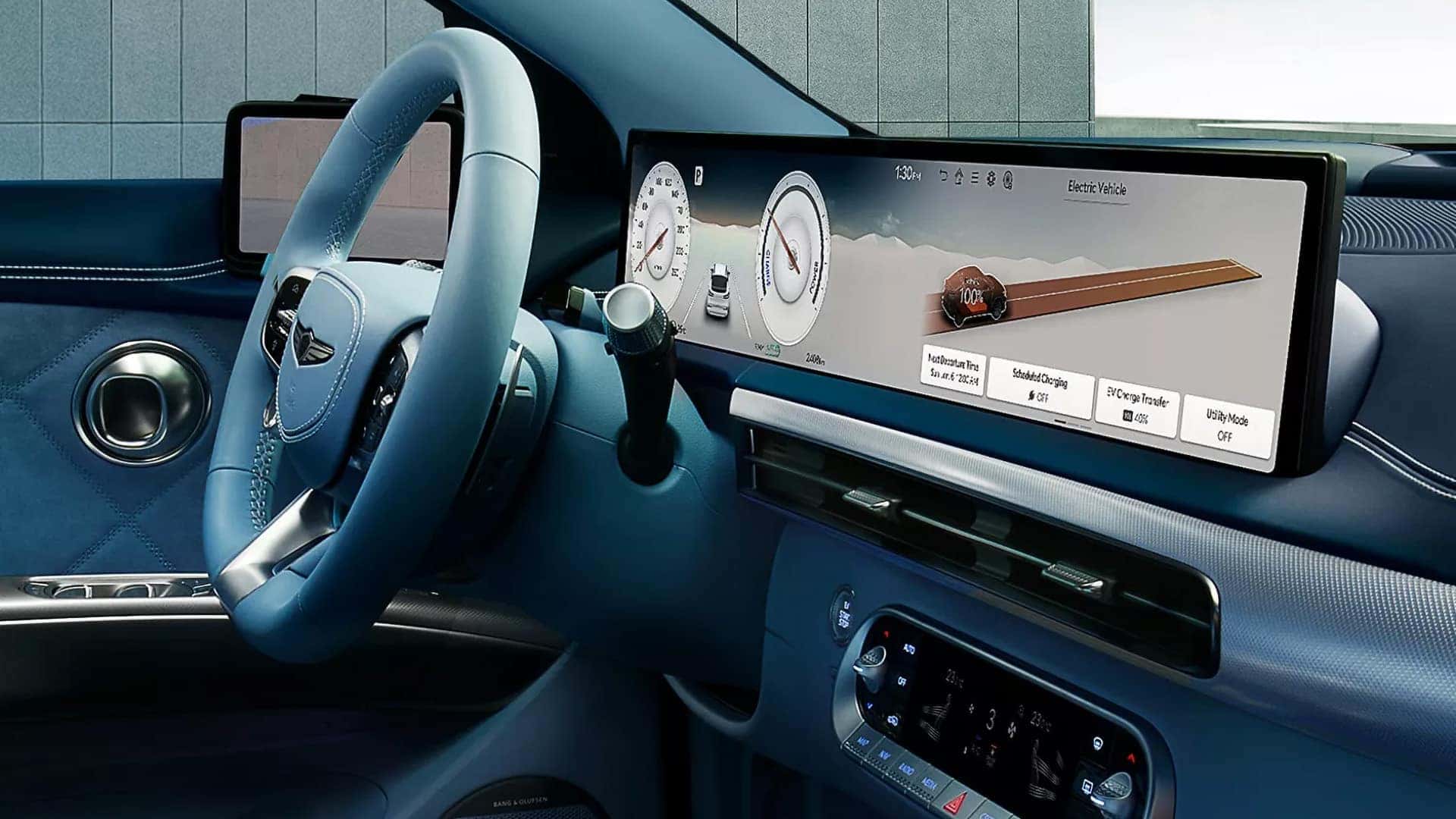 2026 Genesis GV60 cockpit with wide digital display, steering wheel, EV information screen, and climate controls