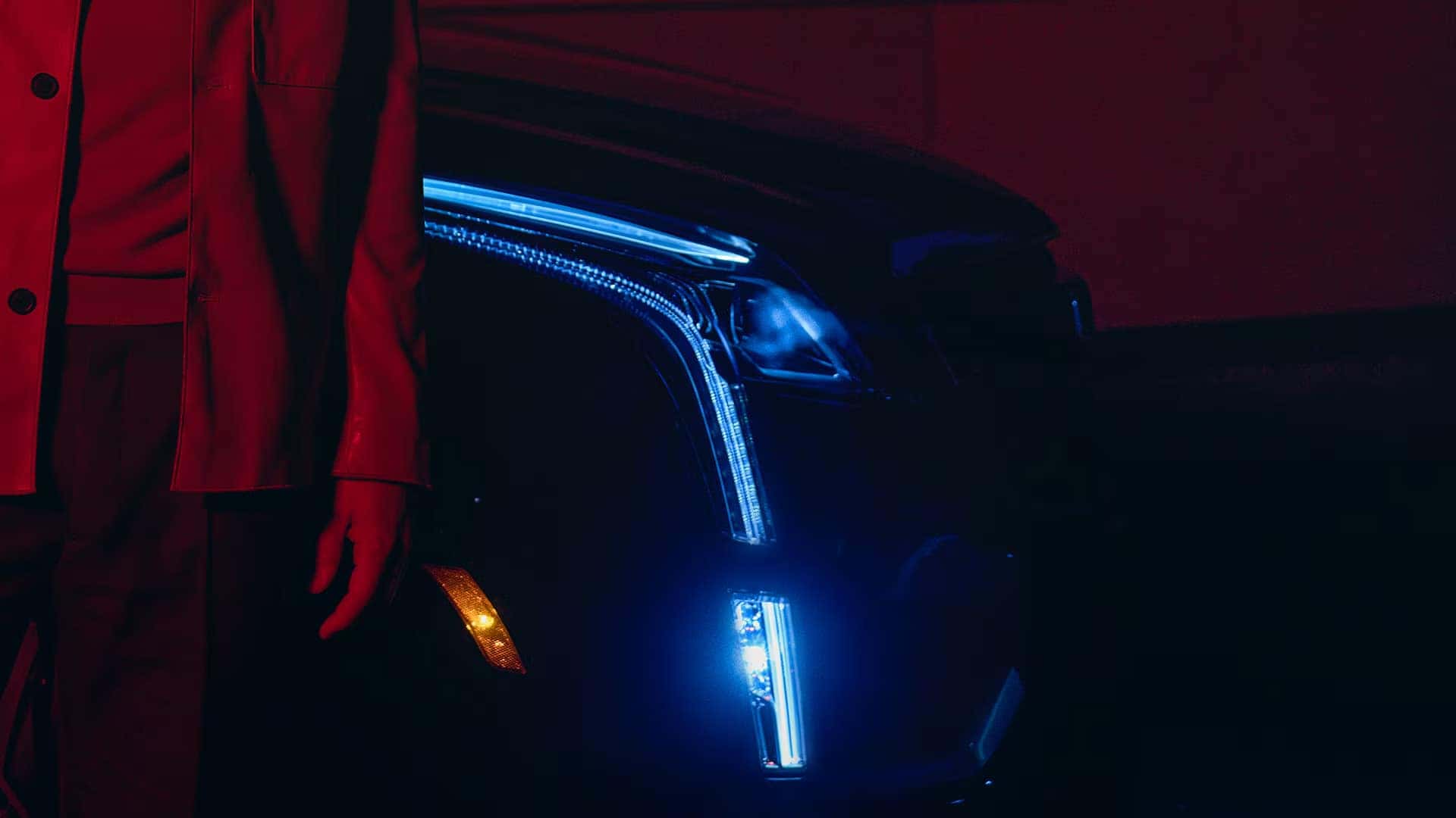 Close up of 2026 Cadillac XT5 front LED lighting with illuminated vertical daytime running lamp and headlamp detail