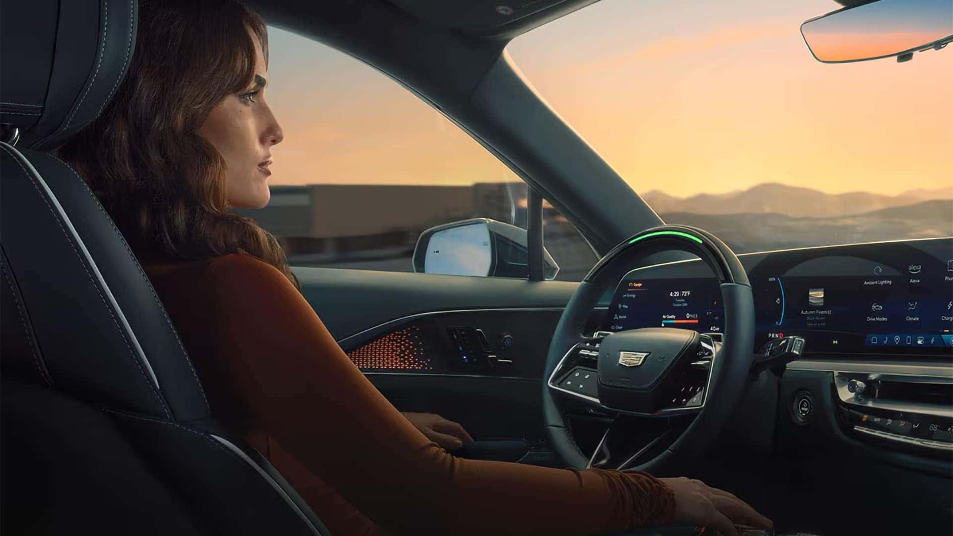 Driver using Super Cruise hands-free driver assistance inside the 2026 Cadillac LYRIQ electric SUV