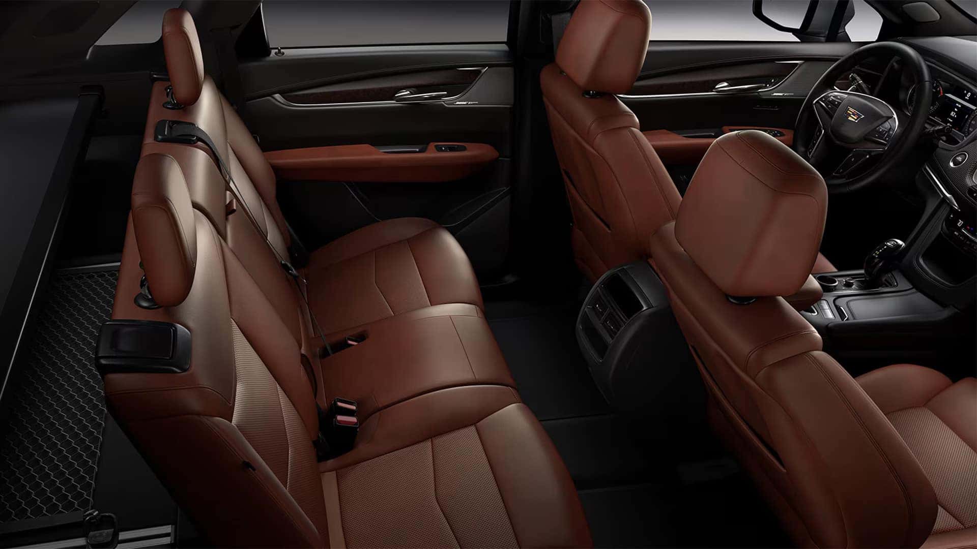 2026 Cadillac XT5 two-row interior with brown leather seating, rear passenger space, and front cabin layout