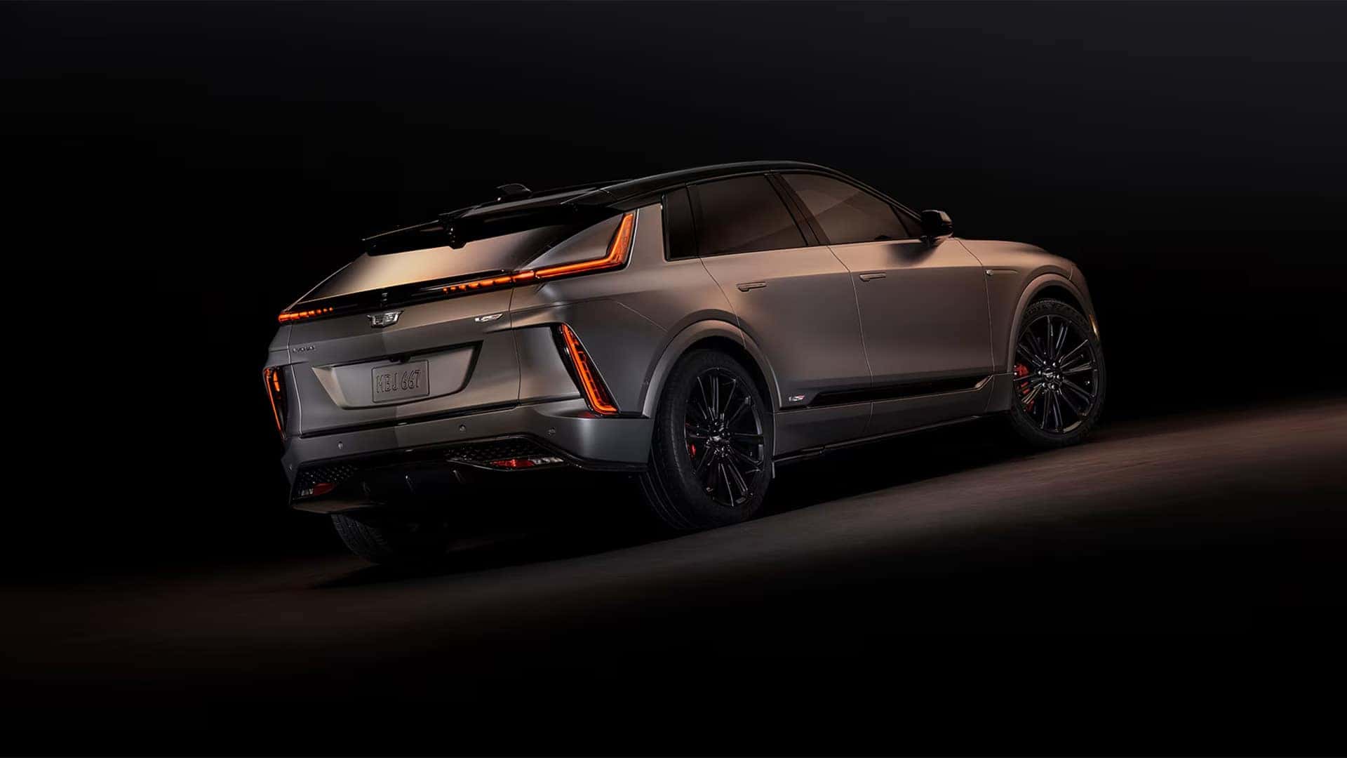 Rear three quarter view of the 2026 Cadillac LYRIQ showing dark exterior trim, LED taillights, and sporty SUV profile
