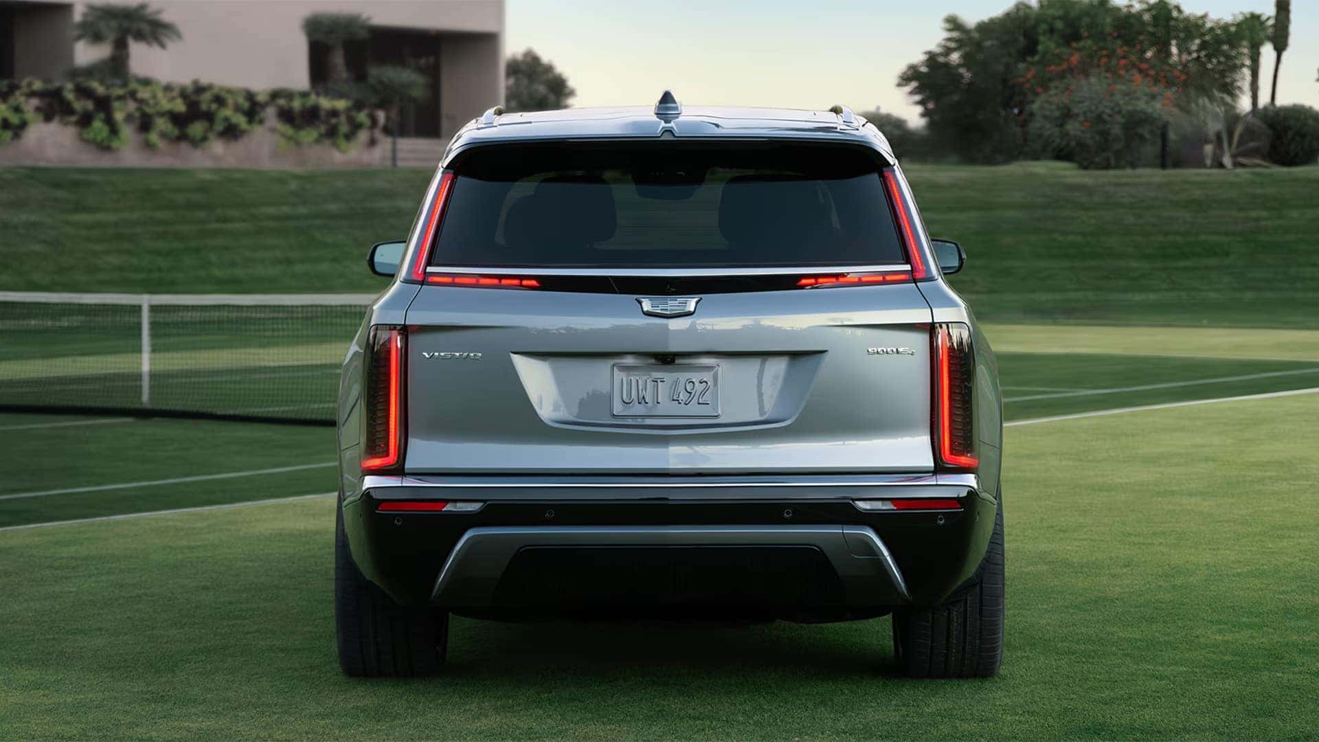 Rear view of the 2026 Cadillac VISTIQ showing vertical LED taillights, liftgate badging, and wide luxury SUV stance