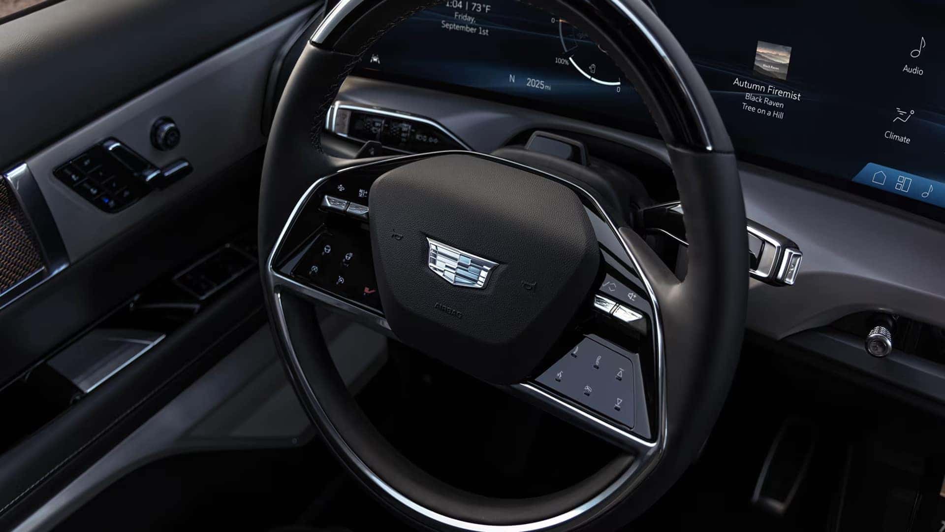 2026 Cadillac VISTIQ steering wheel and digital display with infotainment and driver assistance controls