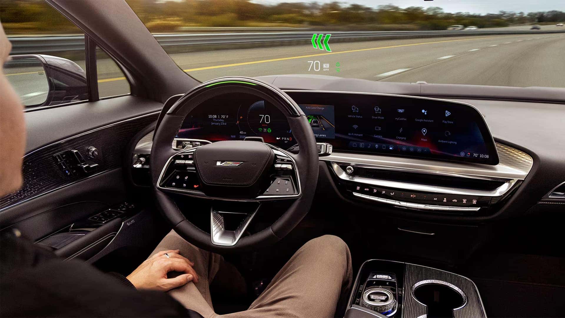2026 Cadillac LYRIQ interior showing Super Cruise driver assistance, head-up display, and 33-inch dashboard screen on the highway