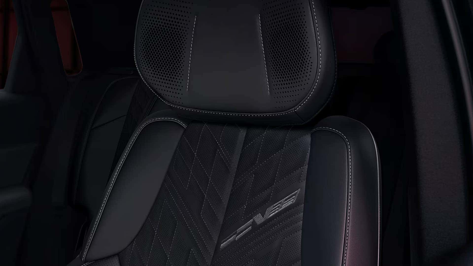 Close-up of 2026 Cadillac LYRIQ-V front seat with performance stitching, perforated upholstery, and V-Series logo