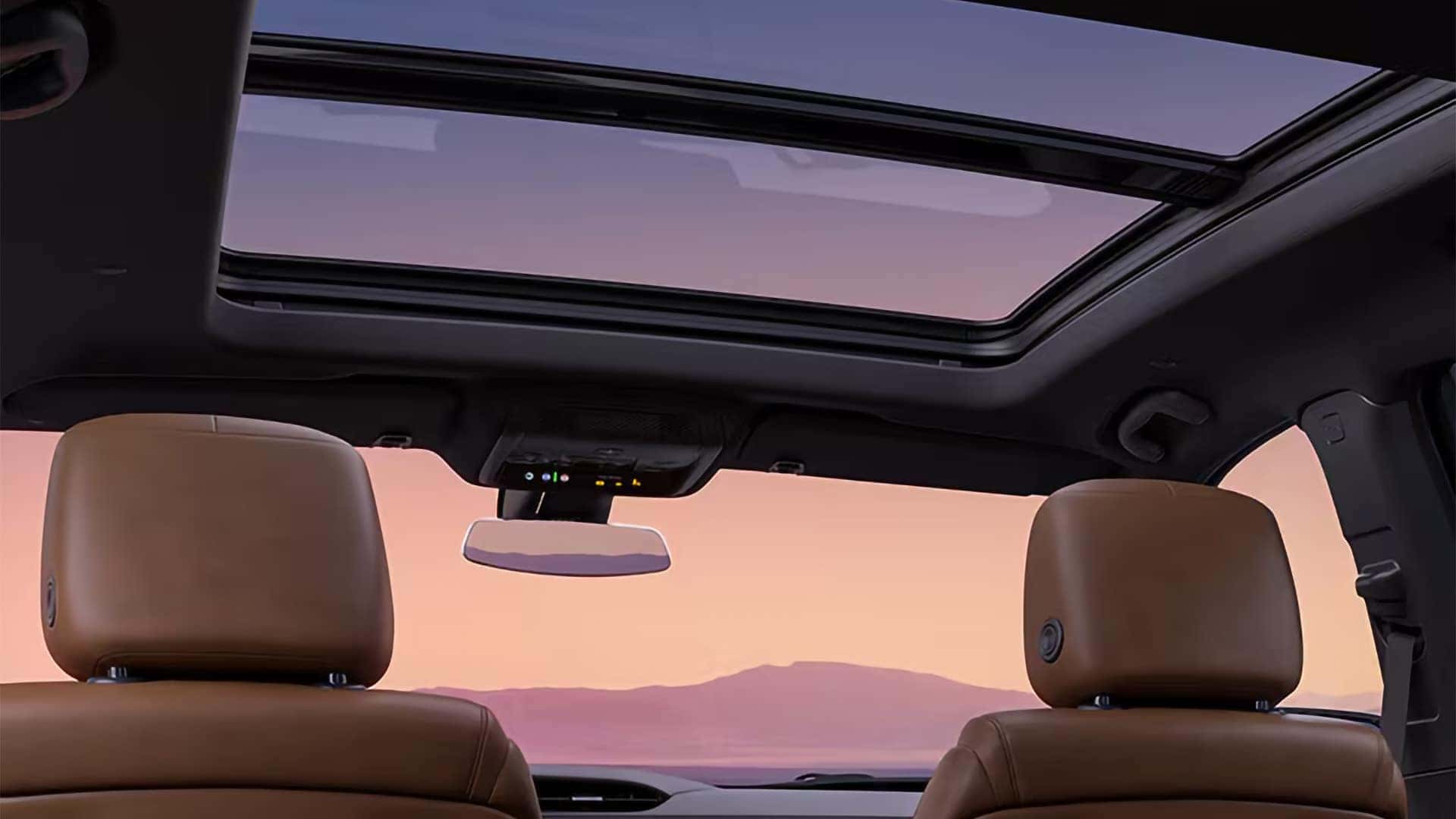 2026 Cadillac XT5 panoramic sunroof with rear cabin view and premium leather seating beneath the glass roof