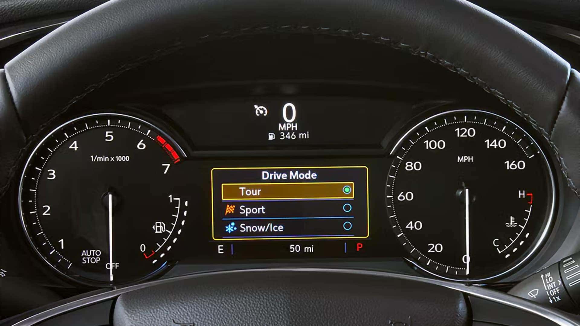 2026 Cadillac XT5 digital driver display showing drive mode options for Tour, Sport, and Snow Ice