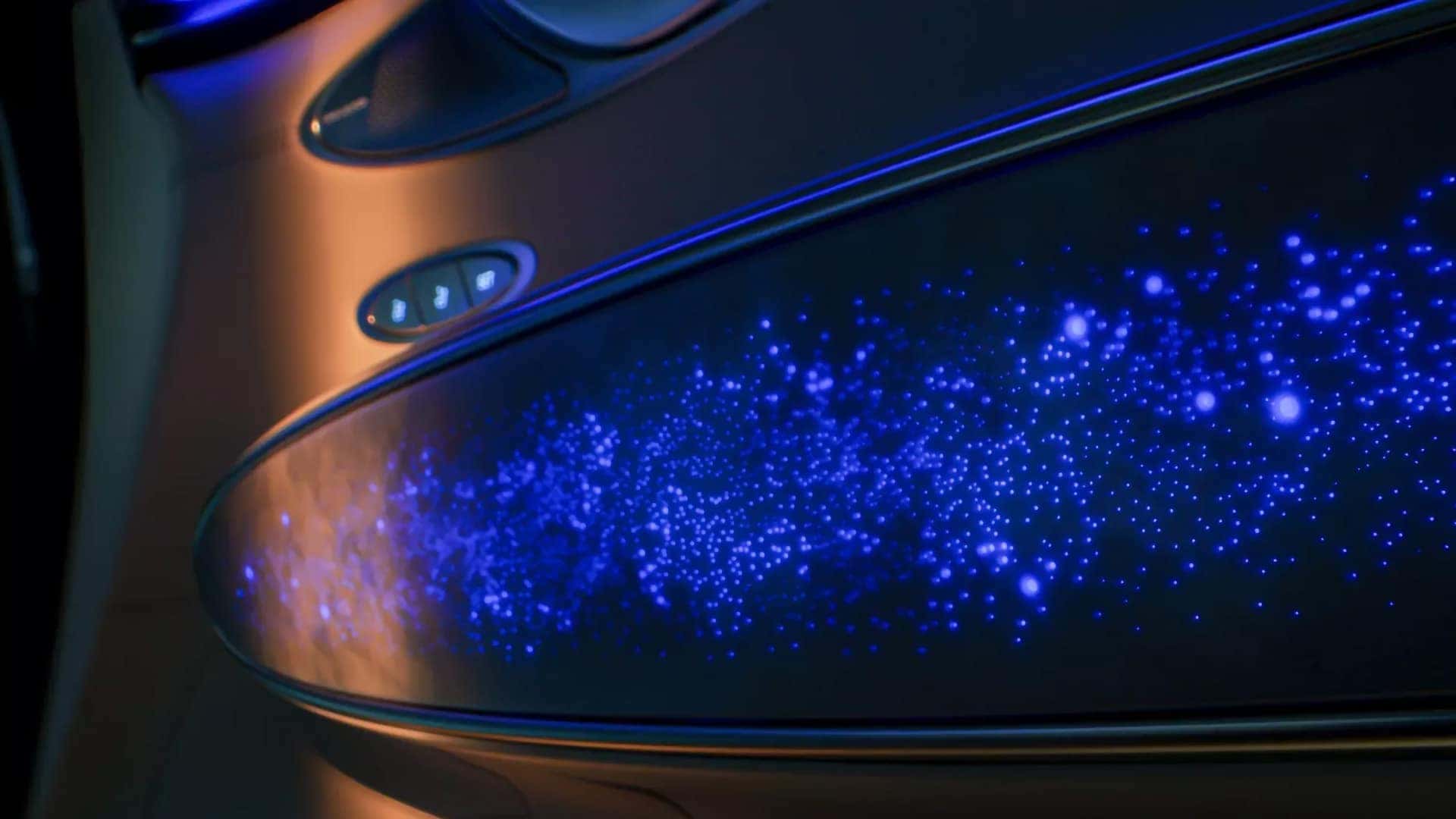 Illuminated Milky Way Pattern door trim inside the 2026 Genesis Electrified GV70 with blue ambient lighting