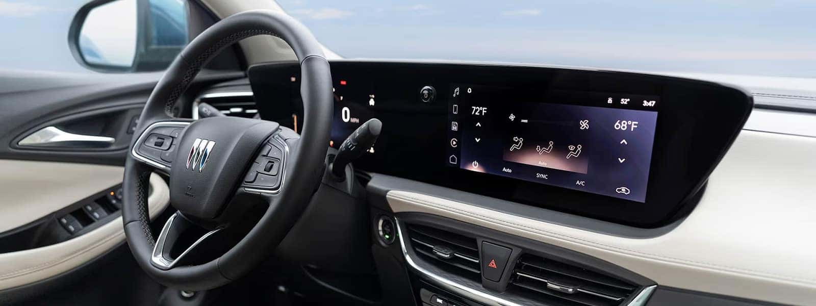 2026 Buick Encore GX interior with steering wheel, digital gauges, and ultrawide infotainment touchscreen
