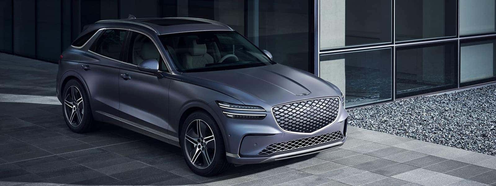 2026 Genesis Electrified GV70 luxury electric SUV parked outside a modern building