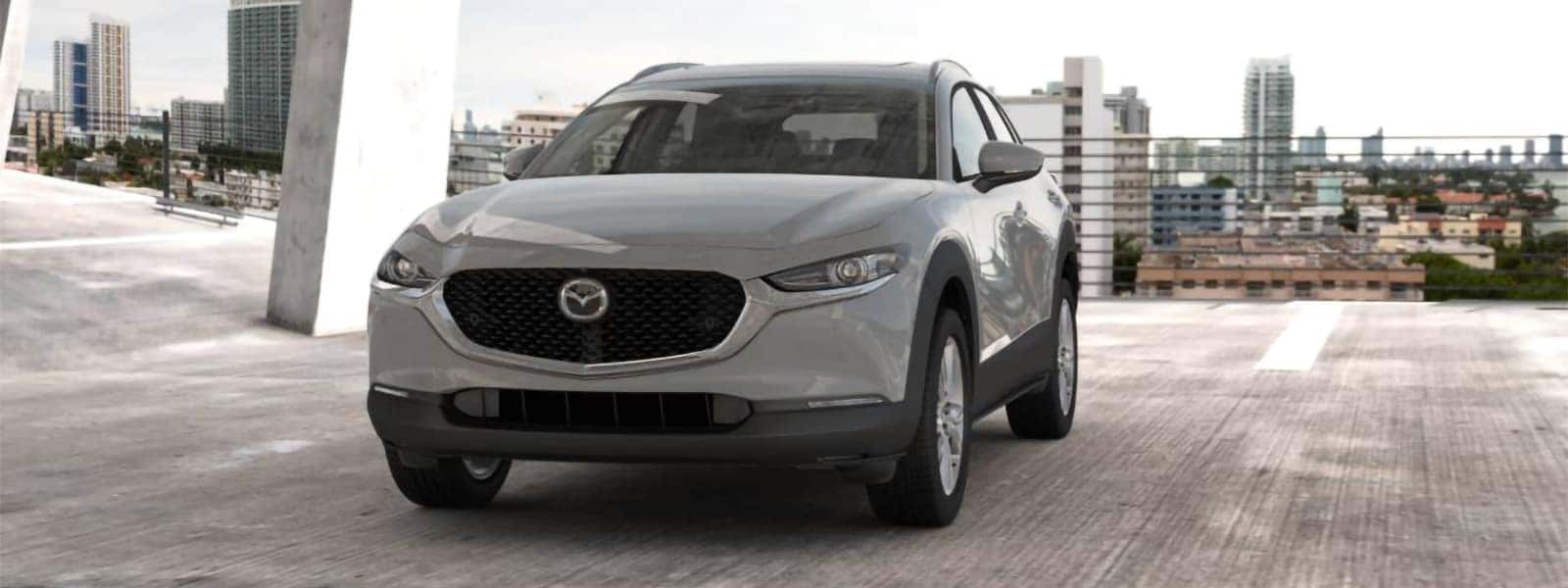 2026 Mazda CX-30 shown from the front on a rooftop overlooking the city
