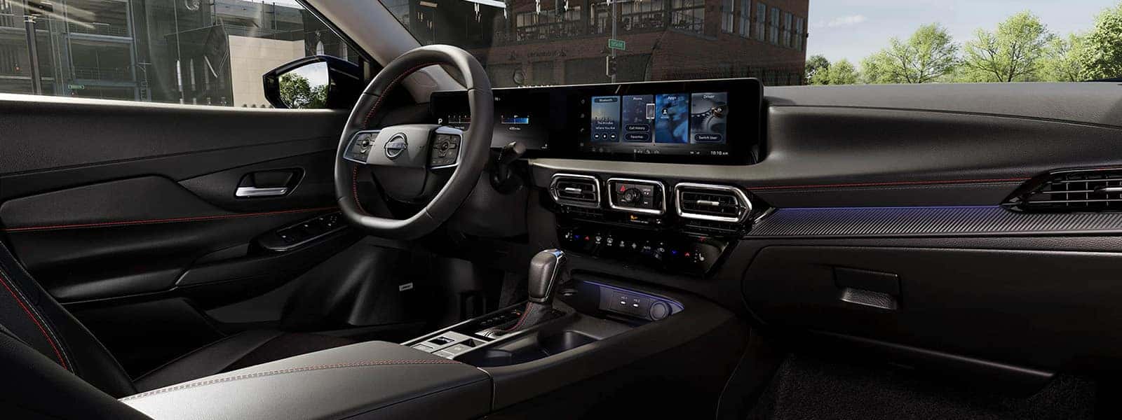 2026 Nissan Sentra interior with digital displays, touchscreen, steering wheel, and center console