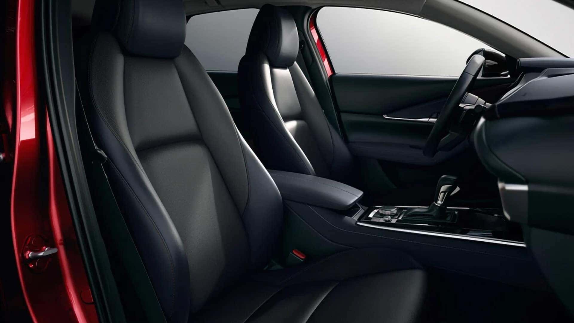 Black front seats, center console, and streamlined dashboard inside the 2026 Mazda CX-30