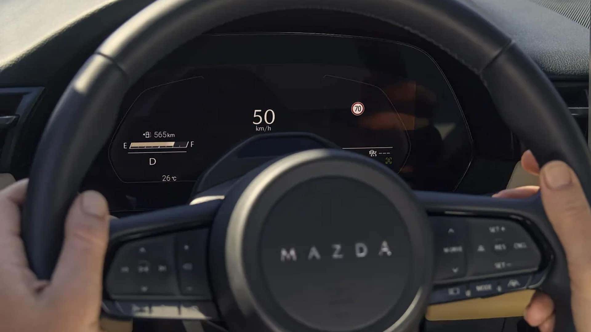 2026 Mazda CX-5 digital gauge cluster showing speed, fuel level, driving range, and safety alerts
